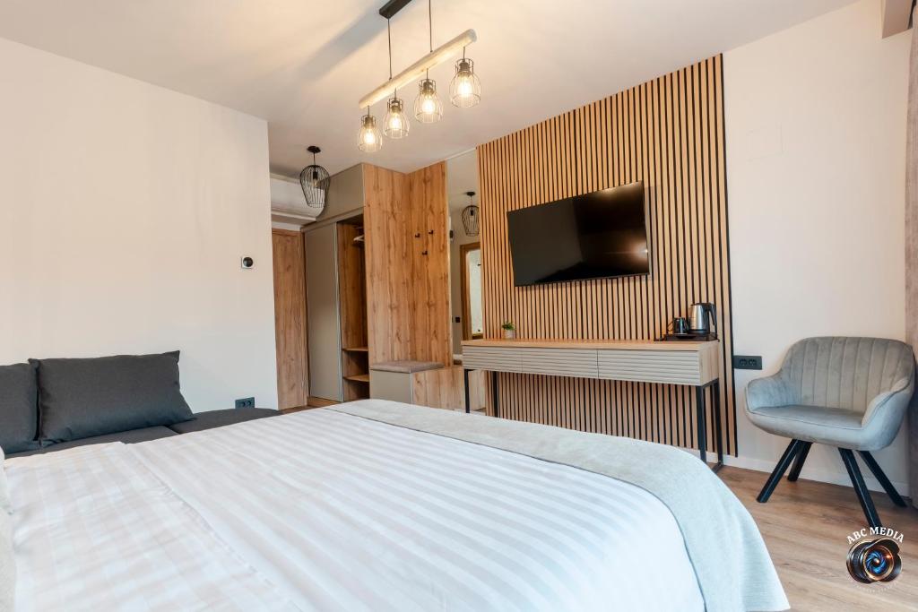 Cameră Triplă Deluxe — cazare Vâlcea, Ecvestria Chalet